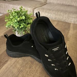 Skechers woman’s Black Slip-On Athletic Sneakers with Silver Eyelets